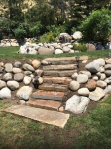 Stone steps installed into existing rock wall